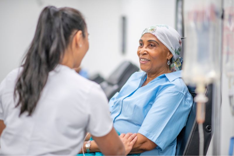 A patient and healthcare worker in conversation